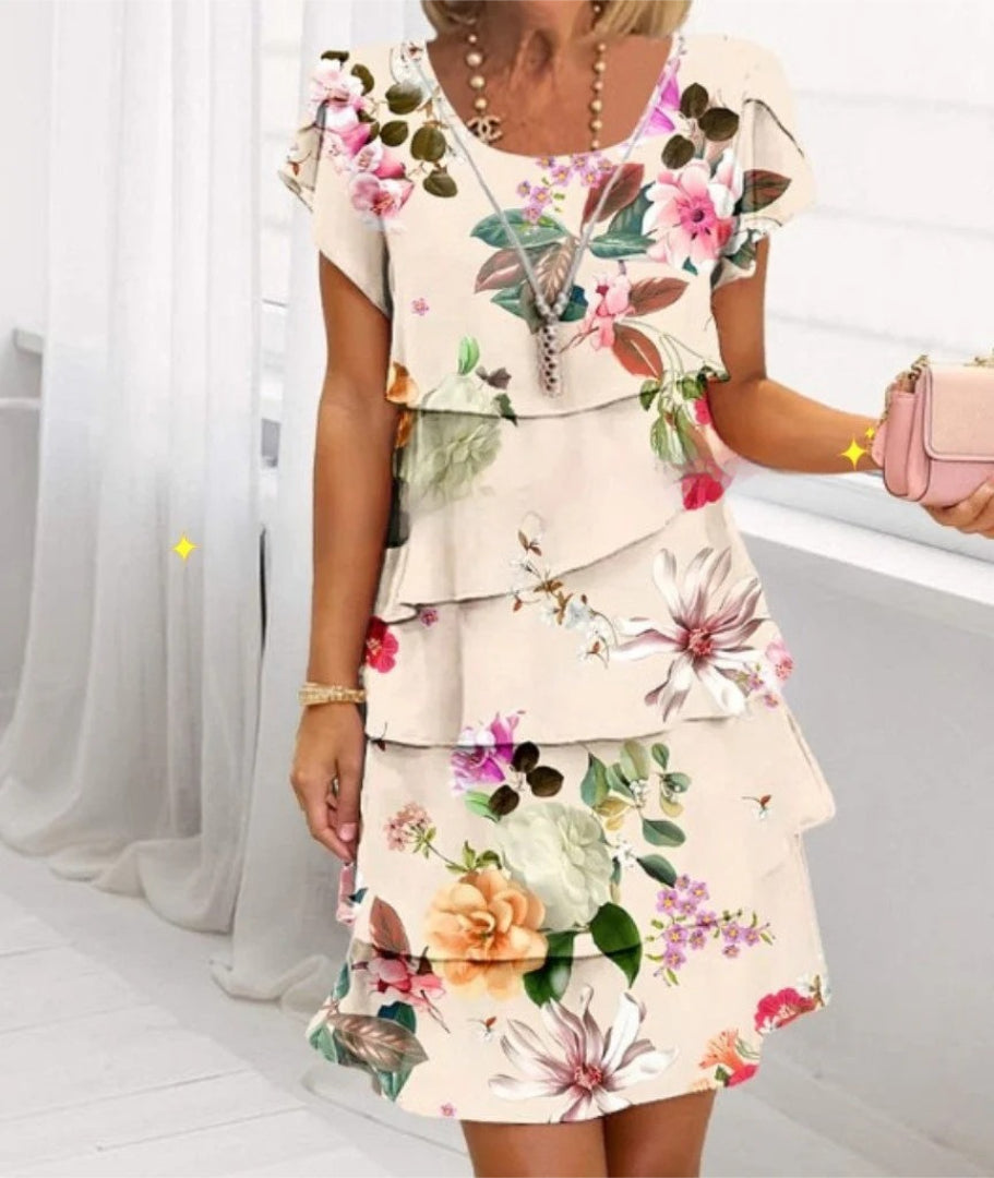 Layered dress with floral print and short sleeves