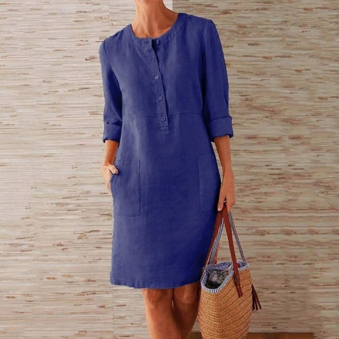 Shirt dress with long sleeves, button-up front, and pockets