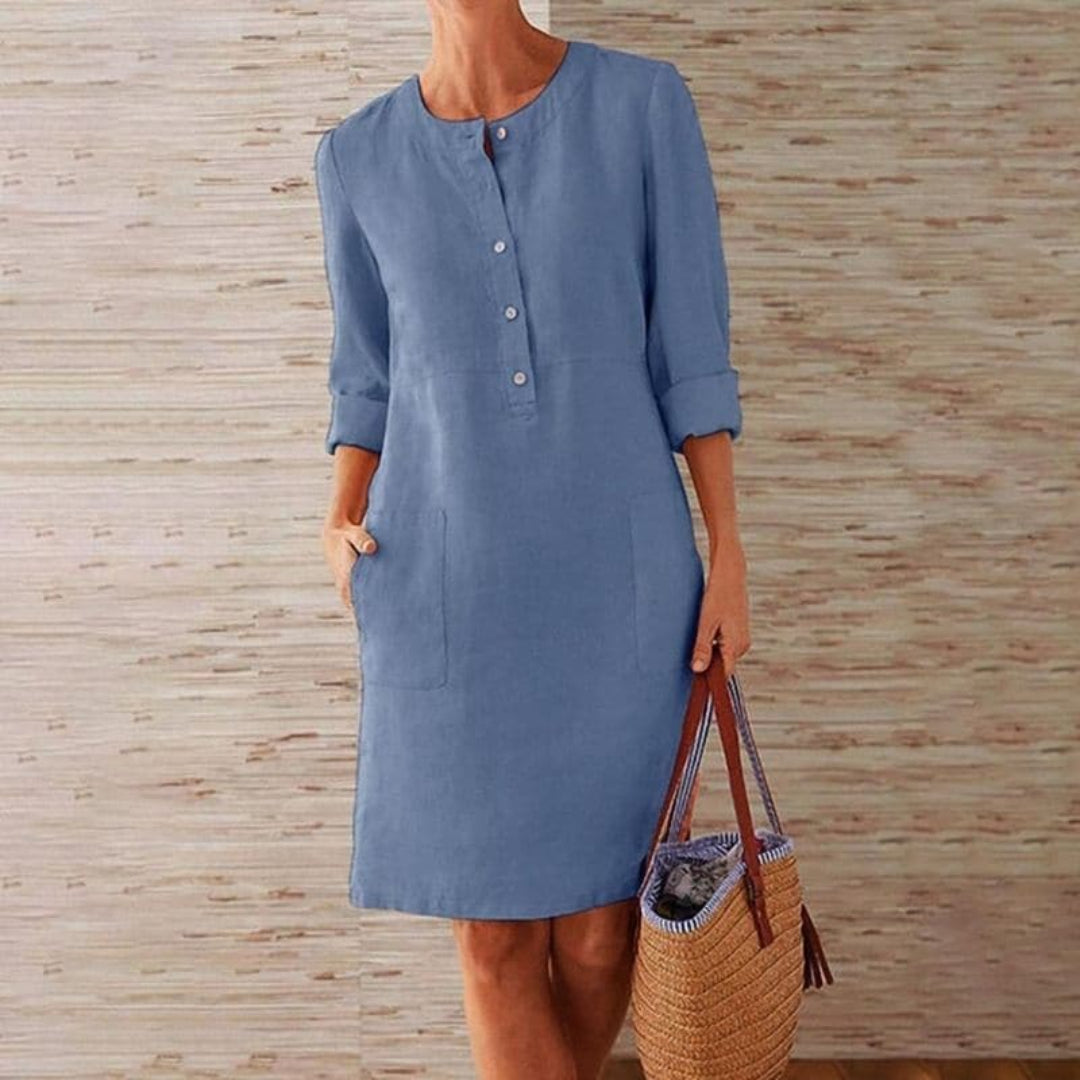 Shirt dress with long sleeves, button-up front, and pockets