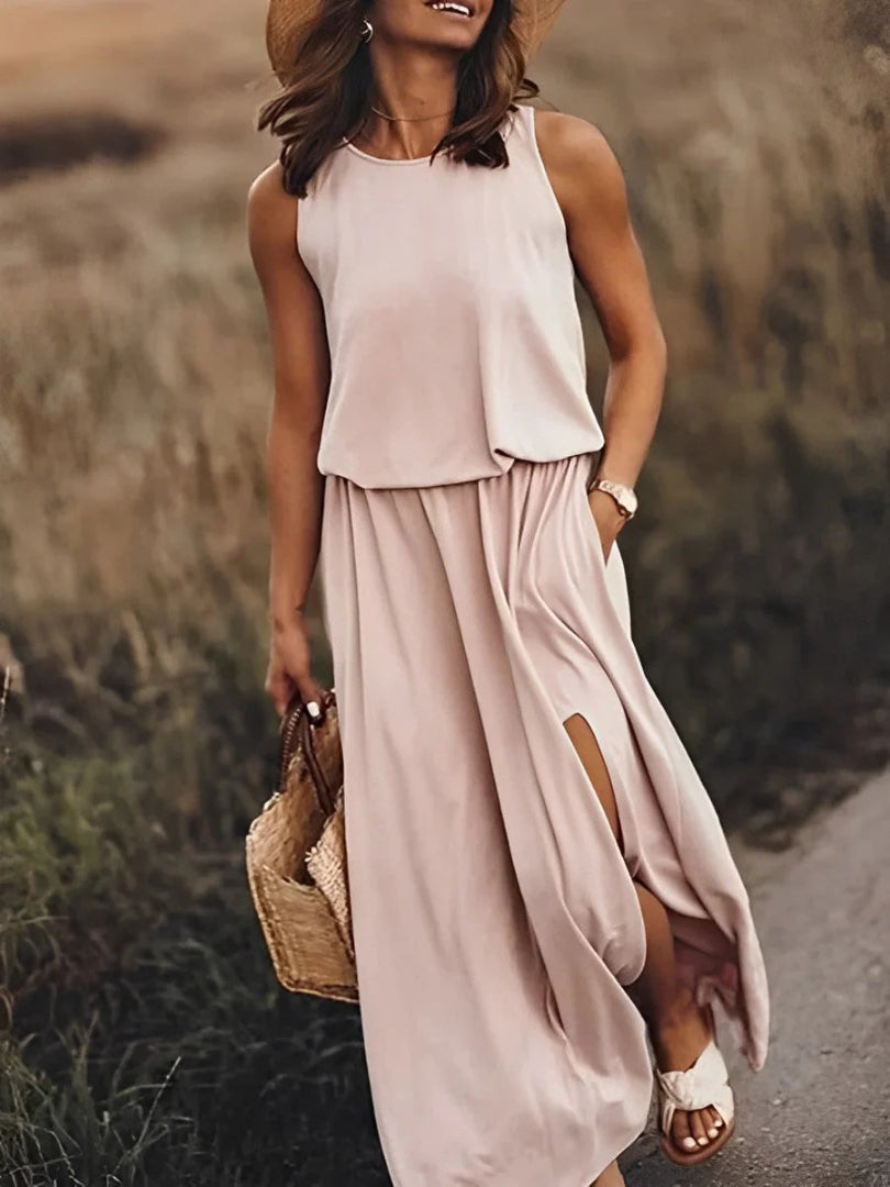 Sleeveless maxi dress with side slit and round neckline