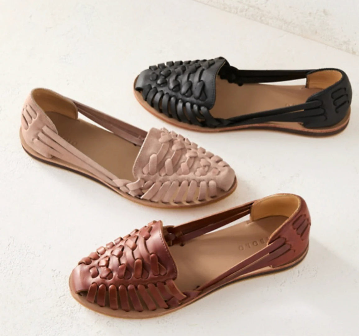 Woven leather sandals with a closed toe
