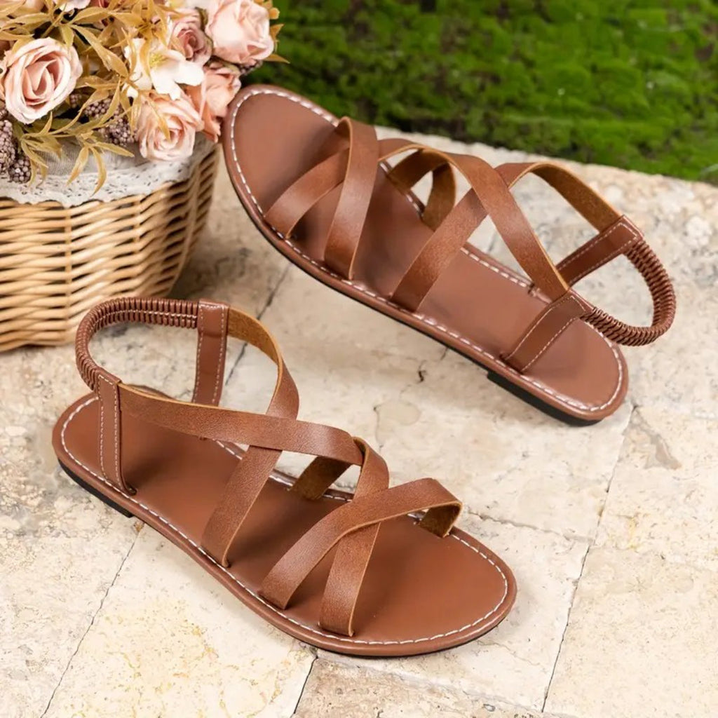 Flat sandals with crisscross straps and elastic back