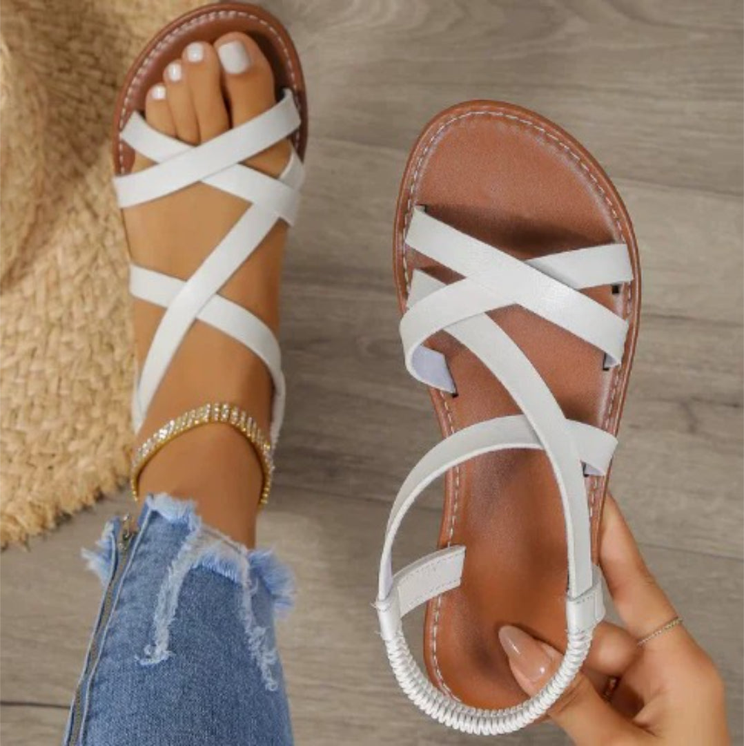 Flat sandals with crisscross straps and elastic back